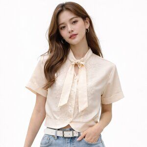 Vintage '50's cropped embroidered blouse with front tie, waistband style hemline